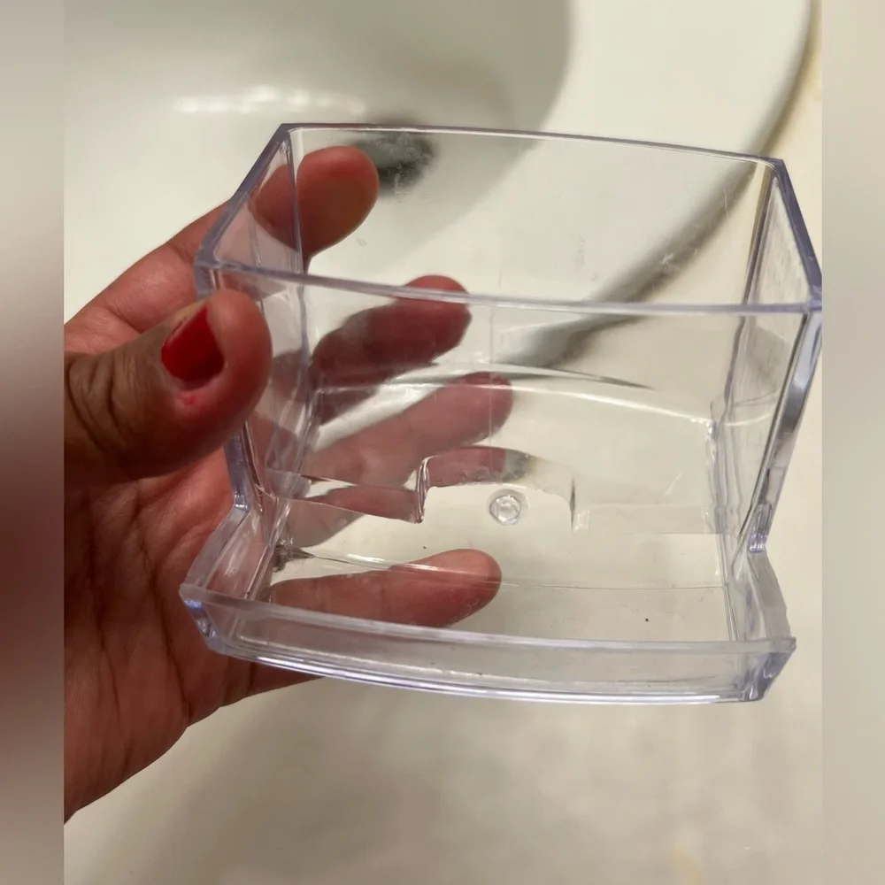 Clear cotton swab holder.